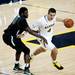 Michigan freshman Mitch McGary drives around Binghamton junior defender Roland Brown on Tuesday. Daniel Brenner I AnnArbor.com